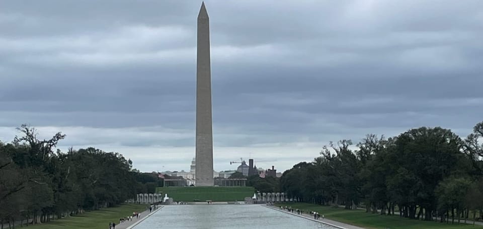 Washington Monument & reflecting pool, storm clouds gathering