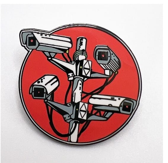 you're probably being watched: surveillance camera badge, white on red background