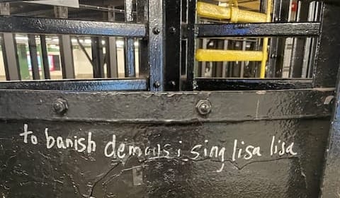 subway graffiti reads "to banish demons i sing lisa lisa"