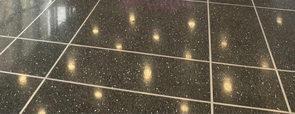 lights reflected in floor grid